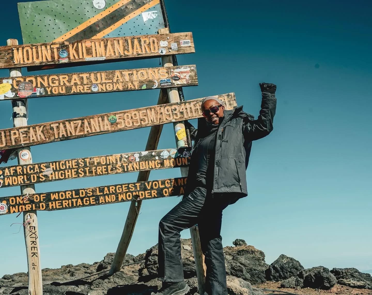 Rose at Uhuru Peak, Mount Kilimanjaro, 5,895m, fist raised in triumph
